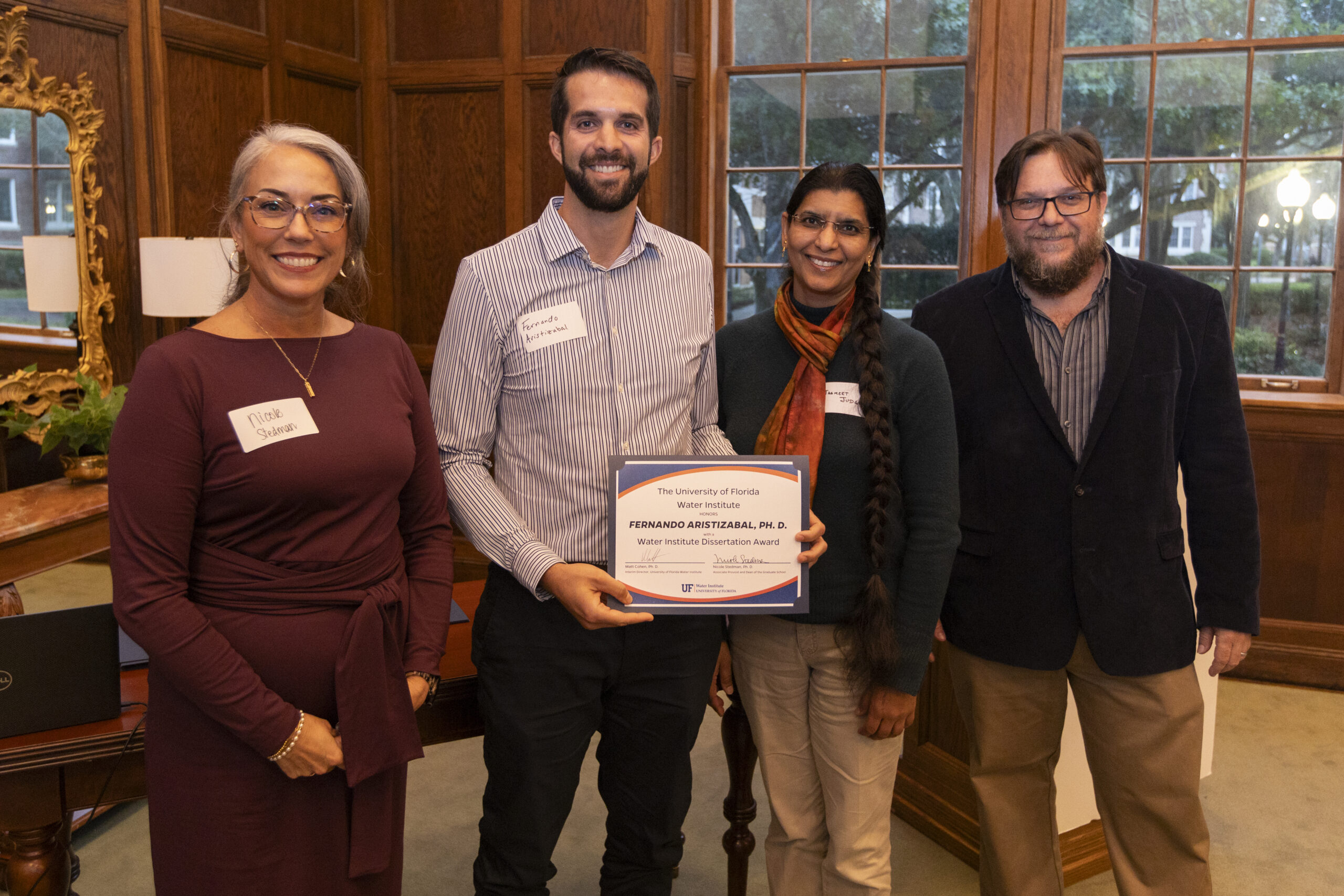 Dr. Fernando Aristizabal being presented with Dissertation Award.