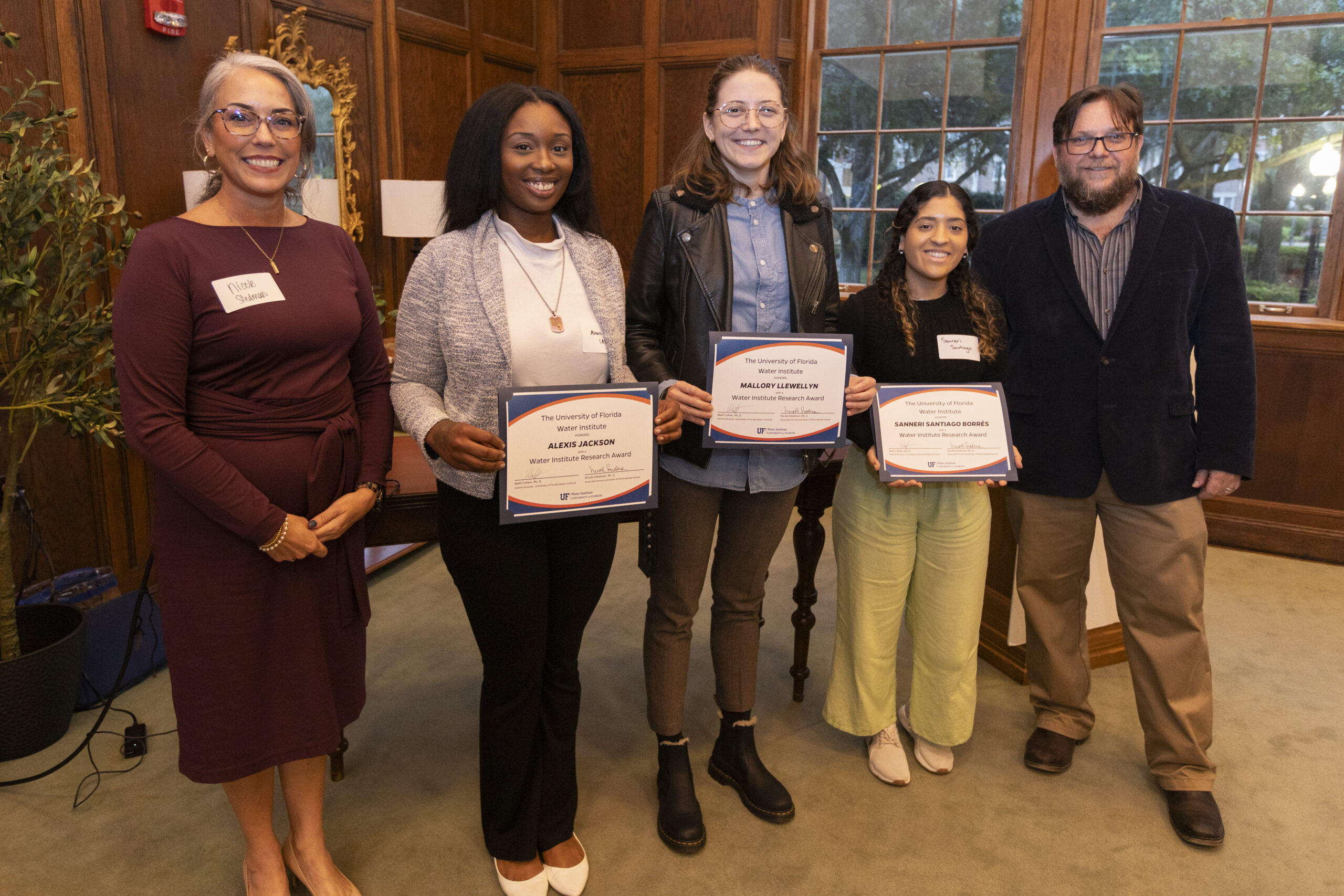 Graduate students being presented with their Research Awards.
