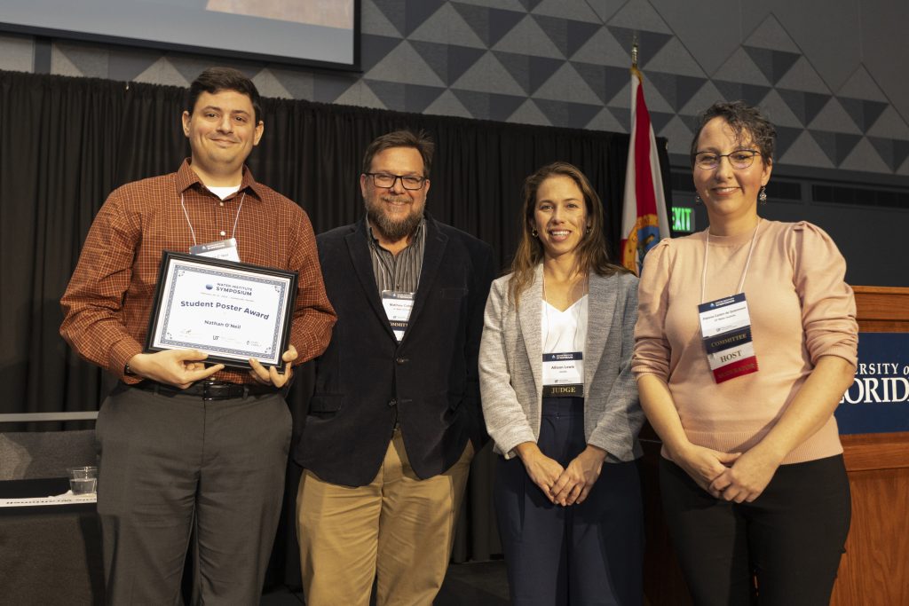 From left to right: Nathan O' Neil, Dr. Matt Cohen, Allison Lewis from Jacobs, and Dr. Paloma Carton de Grammont celebrating Nathan for being selected as a student poster award winner.