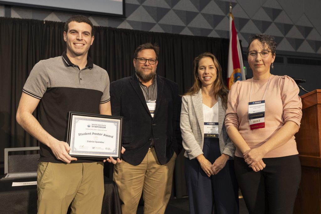 From left to right: Gabriel Spandau, Dr. Matt Cohen, Allison Lewis from Jacobs, and Dr. Paloma Carton de Grammont celebrating Gabriel for being selected as a student poster award winner.