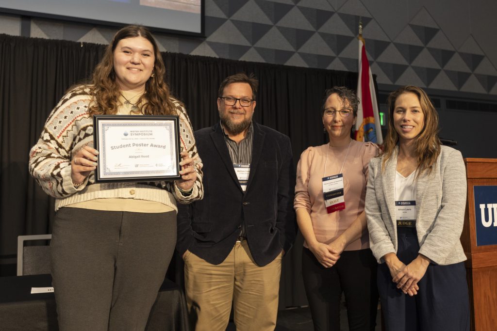 From left to right: Abigail Reed, Dr. Matt Cohen, Dr. Paloma Carton de Grammont, and Allison Lewis from Jacobs celebrating Abigail for being selected as a student poster award winner.